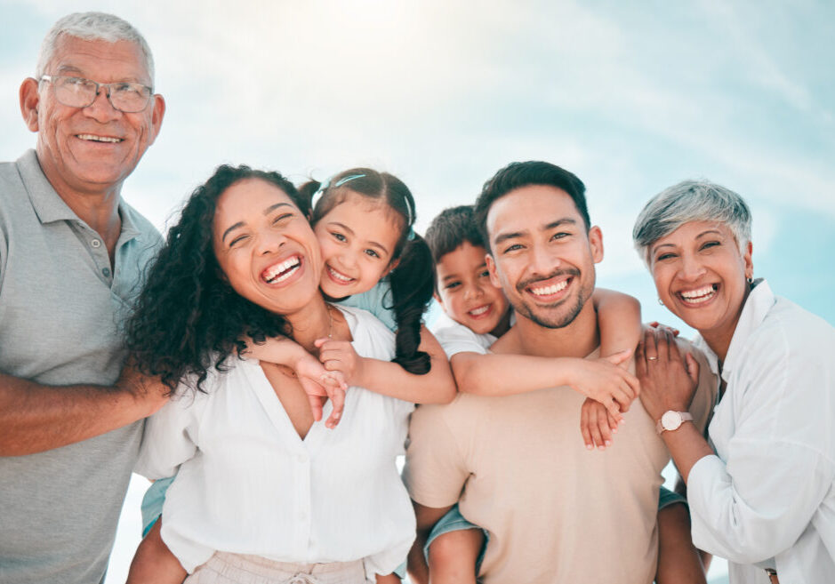 Family, generations and portrait, people in nature and smile with grandparents, parents and children bonding. Happiness, men and women with kids outdoor, love and trust with support while on holiday